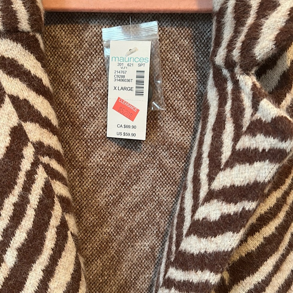 Maurice’s brown zebra print jacket XL new with tags
100% polyester